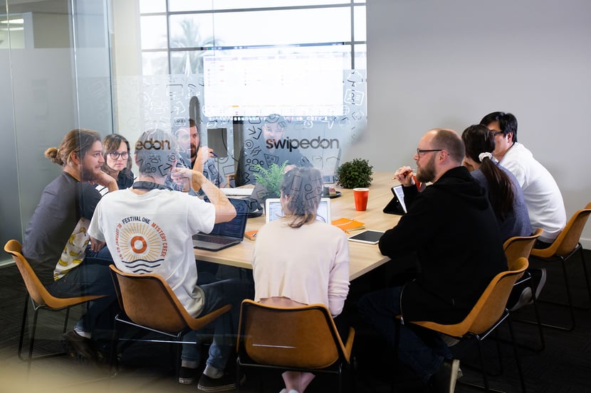 group of employees around table