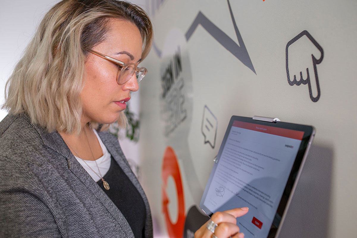 woman signing in on iPad