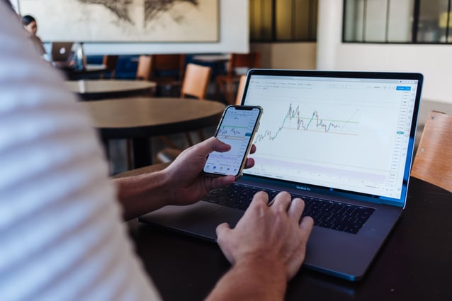 man looking at data on screen